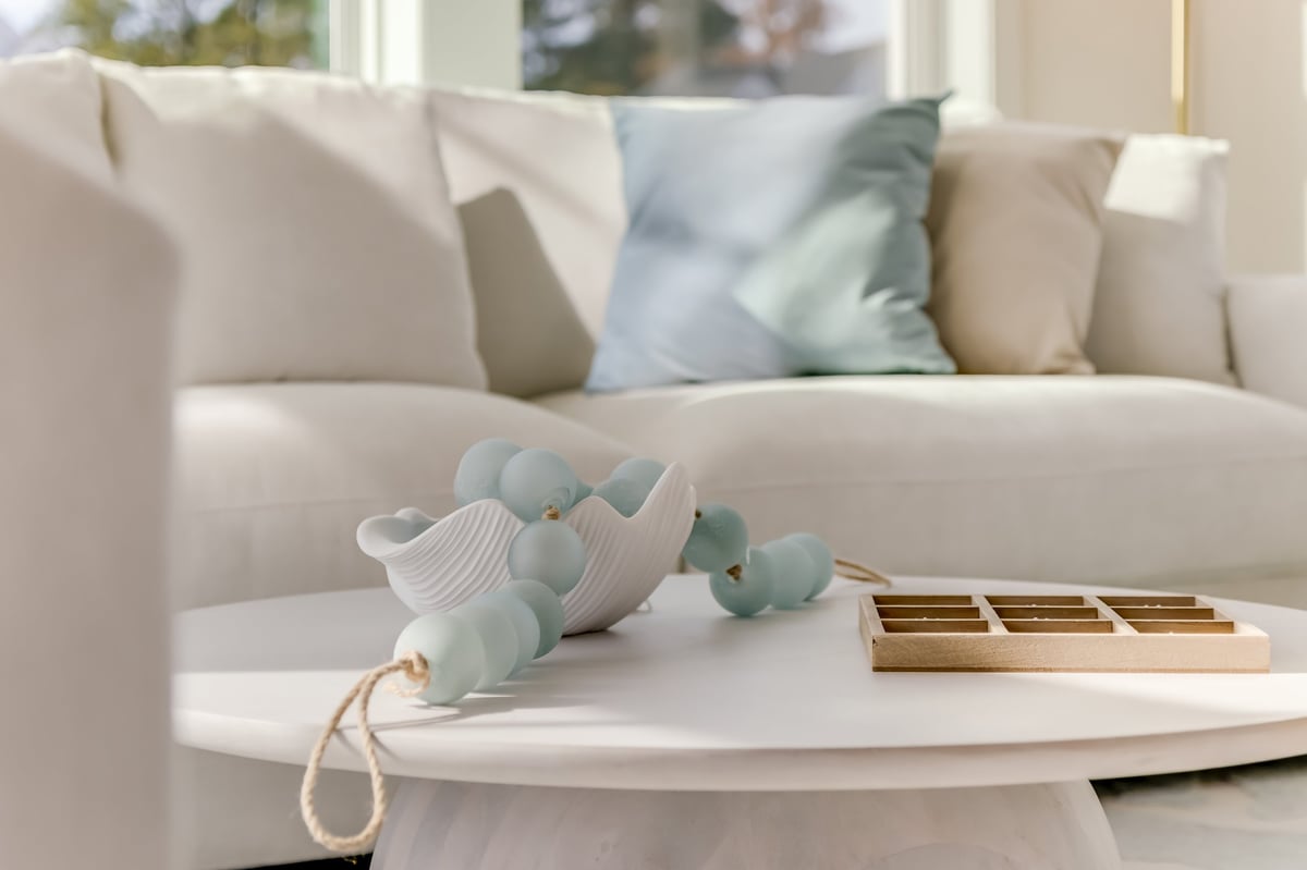 Close-up of a coastal living space with simple centerpieces styled on a coffee table